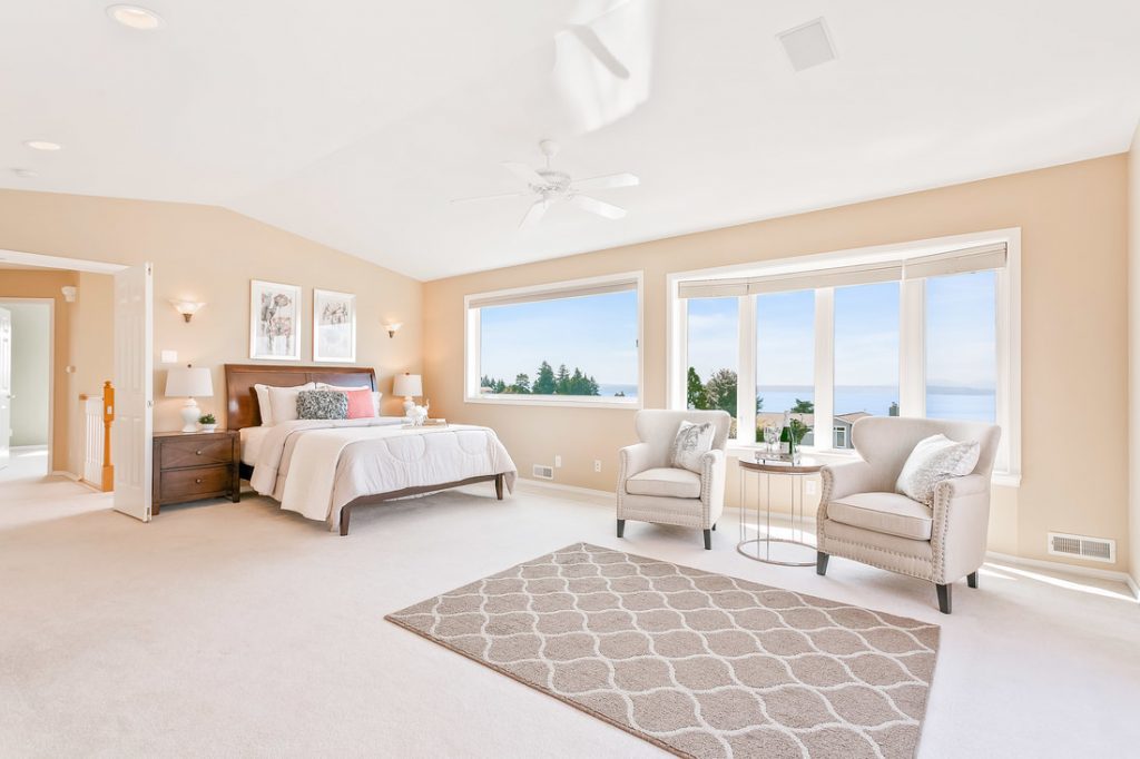 Ocean view residential room of a real estate with a bed
